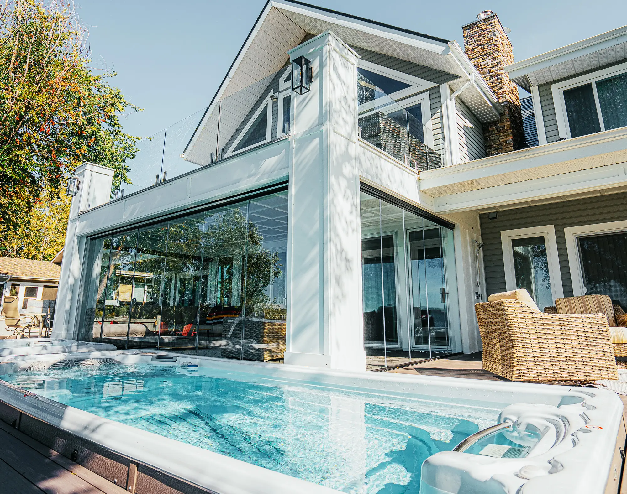 Custom sunroom with Lumon frameless balcony glazing installed by Star Construction WA in Seattle